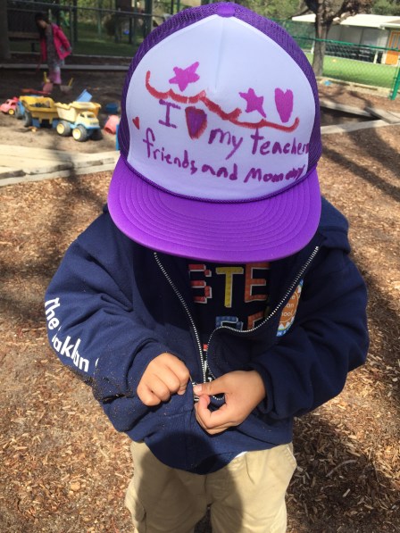 Cameron in purple hat